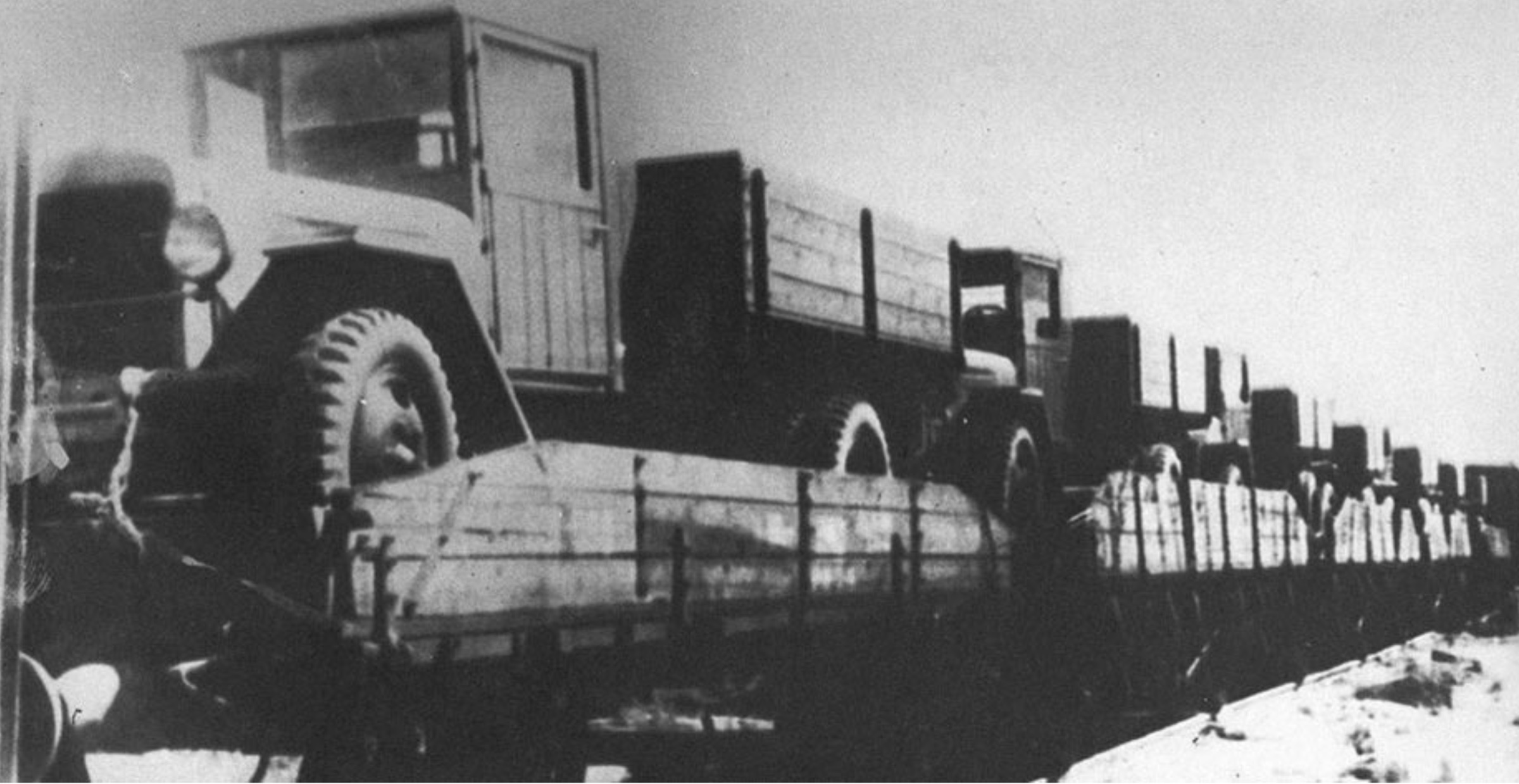 Early trucks transported on railway wagons during the wartime formation of the Miass plant